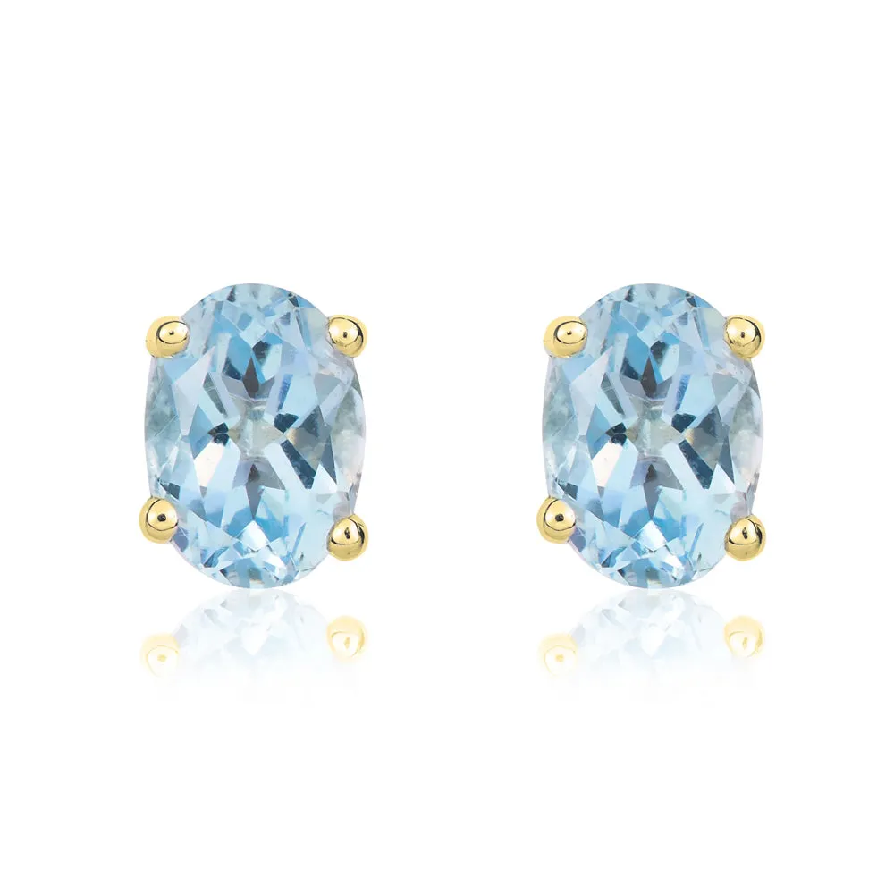 9ct Yellow Gold Aquamarine 7x5mm Oval Claw Set Stud Earrings