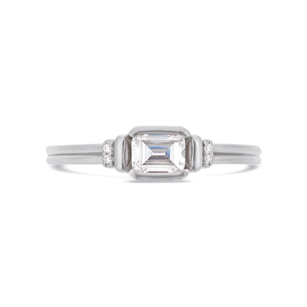 Deco emerald cut solitaire diamond ring in platinum