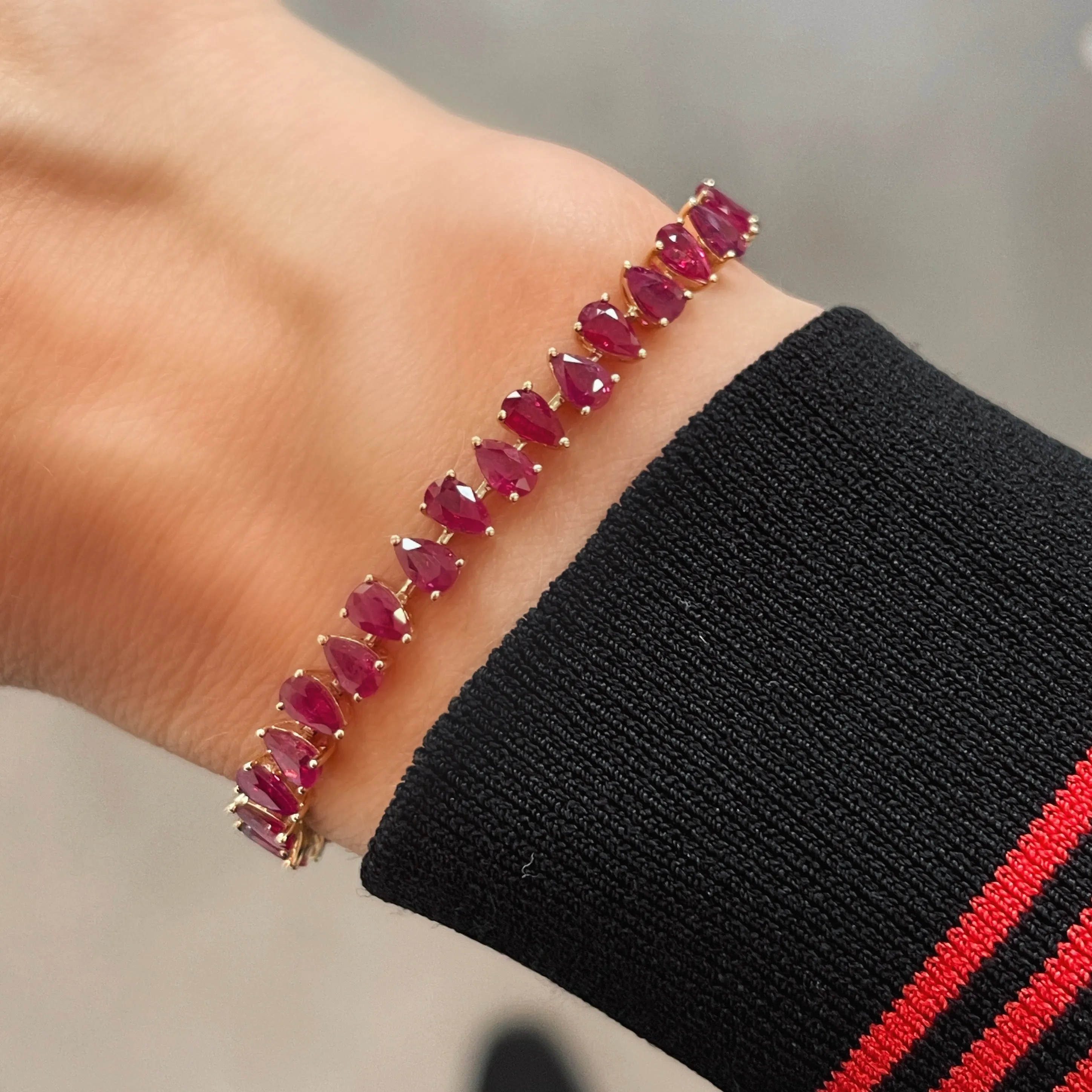 One of a Kind Juicy Pear Shaped Ruby Tennis Bracelet