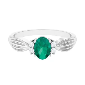 Oval Emerald Solitaire Engagement Ring with Diamond Accent